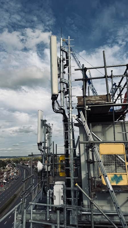 Completed sector steelwork, antenna panels and bracing on a rooftop mast